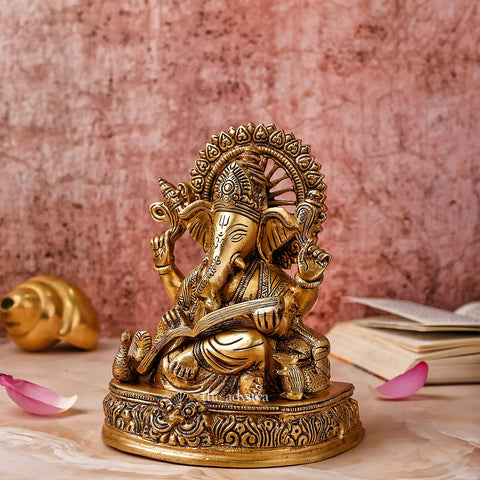 Ganesha,Ganepati,Ganasha,Ganapati,Gajanand,Gajananaa,Gajanana,Ekadanta,Lord Ganesha Sitting With Book