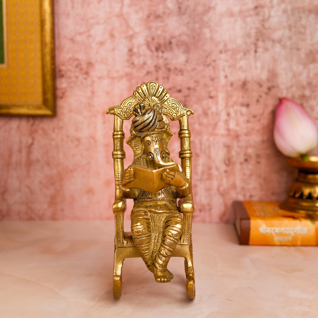 VIghnaharta,Vinayaka,Vinayak,Vigneshwara,Vighneshvara,Vakratunda,Taruna,Ganapati,Gajanand,Brass Ganesha Reading Book On Chair