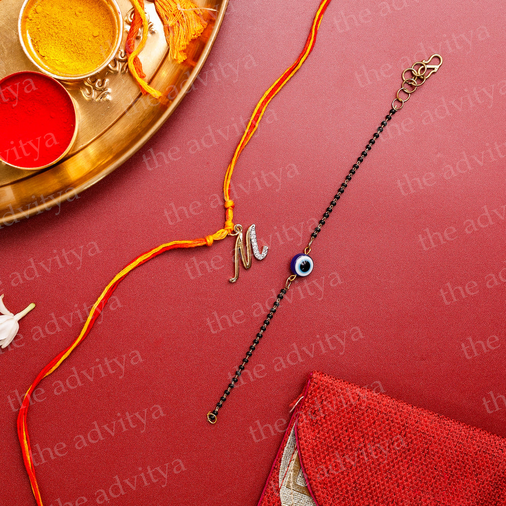 Rakhi,Handmade Rakhi,Rakhi Special Collection,Rakhi gifting,Alphabet M Rakhi Designs in AD Pendant with Black Evil Eye Bracelet