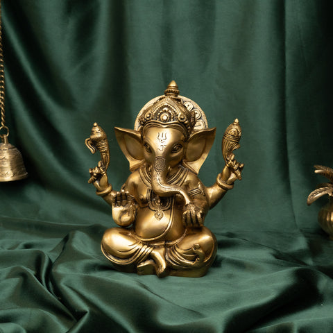 Brass Ganesha statue in sitting and blessing posture with detailed craftsmanship