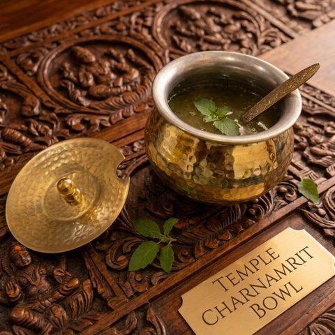 Hammered brass ghee pot placed on wooden board