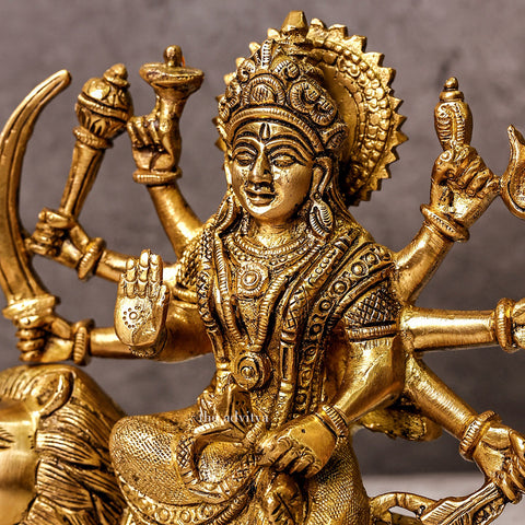 Durga murti with eight hand sitting on lion side view.