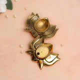 Brass lotus diya in golden finish used for mandir and festive home décor.