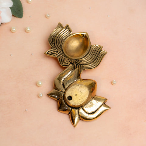 Brass lotus diya in golden finish used for mandir and festive home décor.