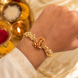 Handcrafted Divine Ganesha Pearl Rakhi for Raksha Bandhan with Roli Chawal