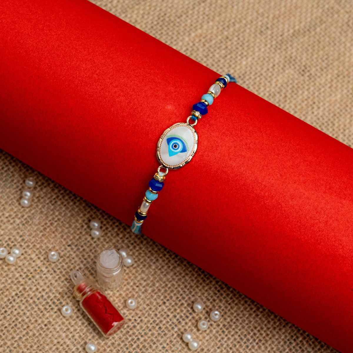Evil Eye Thread Rakhi for Bhai  (Roli + Chawal)