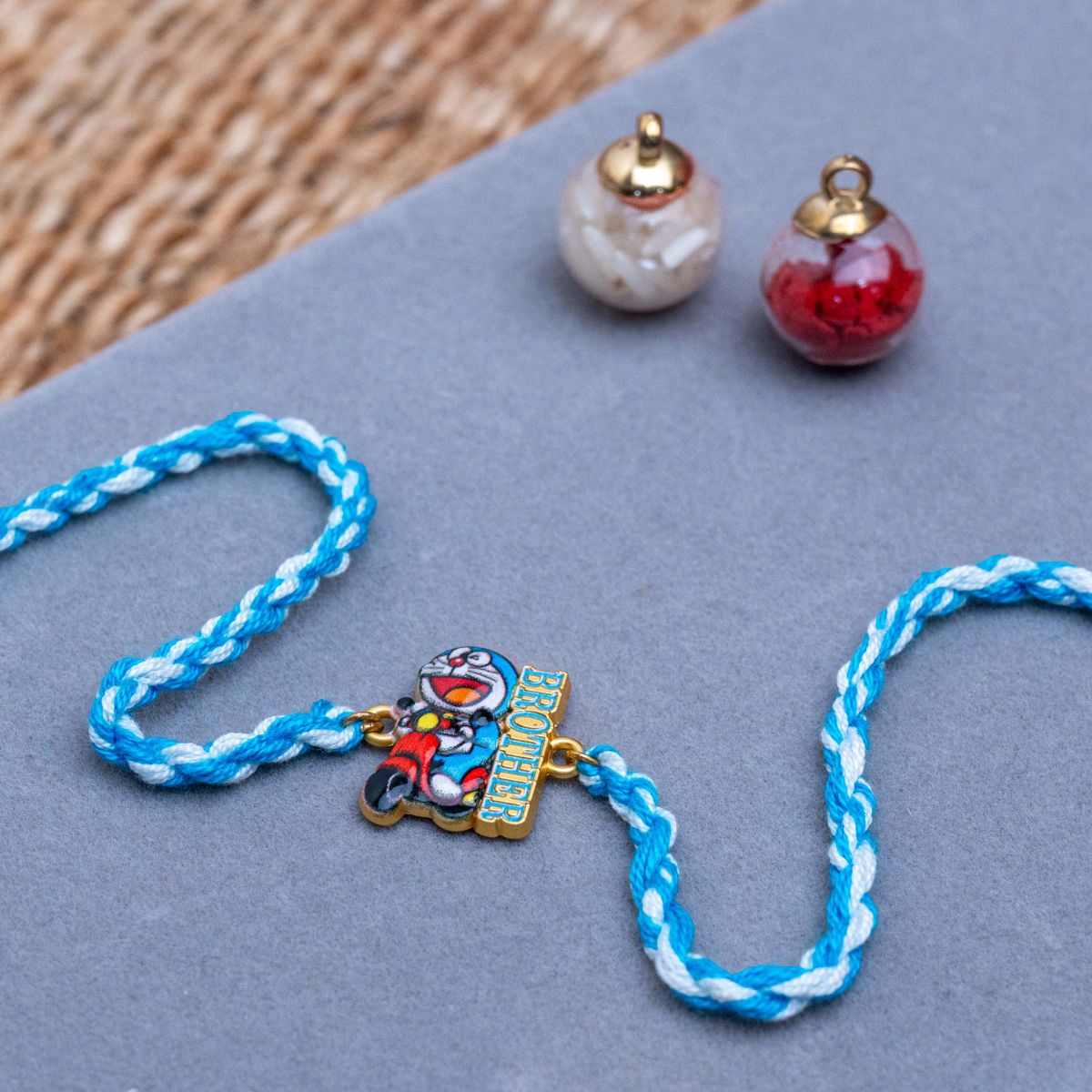 Kids Doraemon Thread Rakhi of Silicon with Roli Chawal