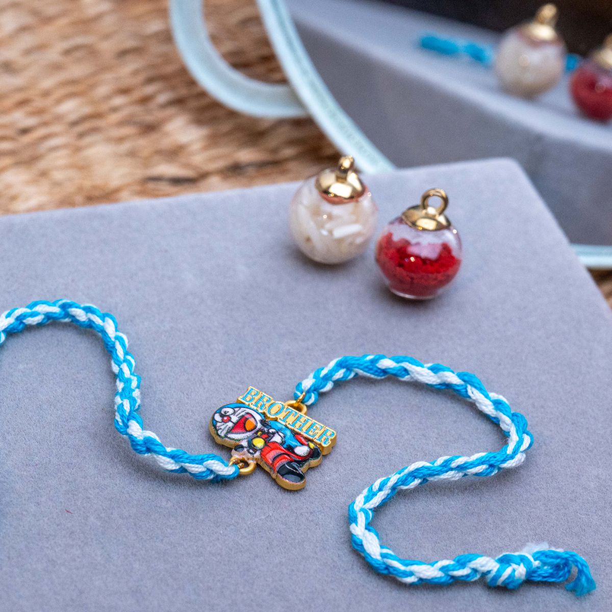 Kids Doraemon Thread Rakhi of Silicon with Roli Chawal