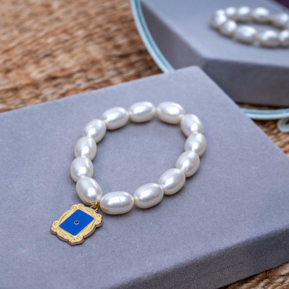 Friends TV Show Charm in Pearl Bracelet Rakhi for Sister  with Roli Chawal