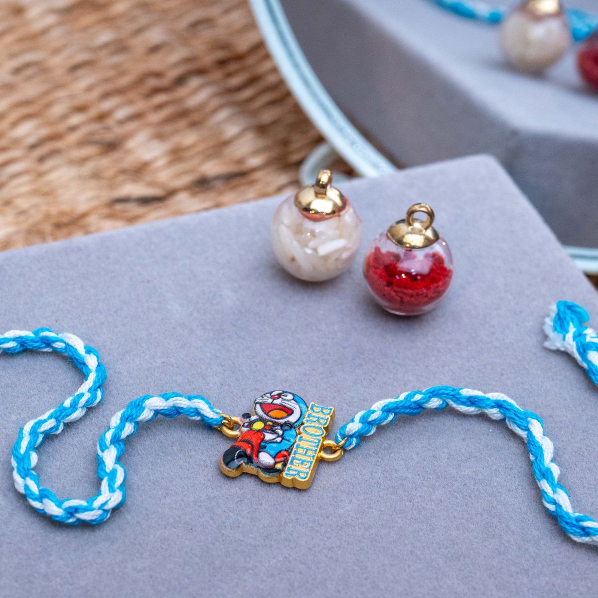 Kids Doraemon Thread Rakhi of Silicon with Roli Chawal
