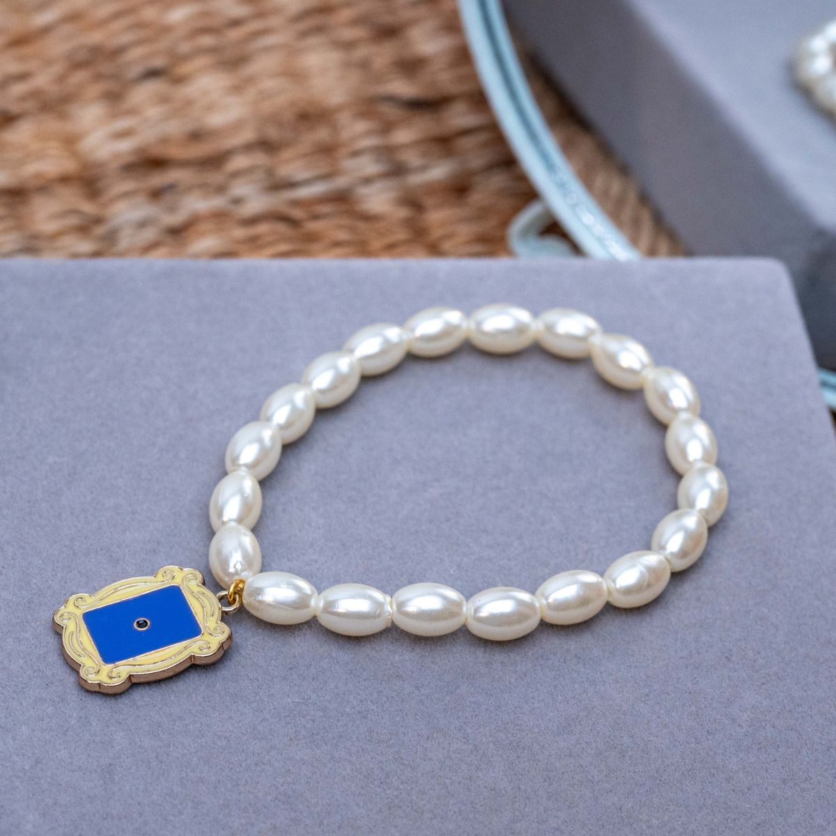 Friends TV Show Charm in Pearl Bracelet Rakhi for Sister  with Roli Chawal