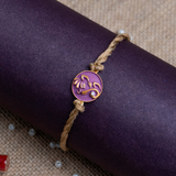 Ganesha Face Rakhi for Brother With Roli Chawal (Purple)