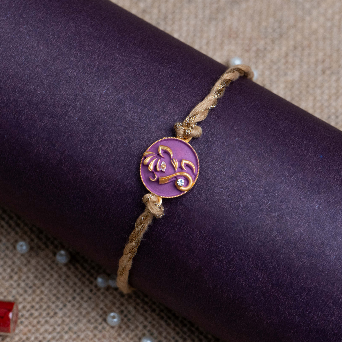 Ganesha Face Rakhi for Brother With Roli Chawal (Purple)