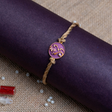 Ganesha Face Rakhi for Brother With Roli Chawal (Purple)