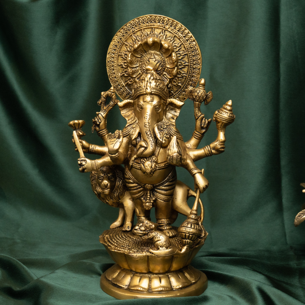 Close-up of Ashtabhuja Lord Ganesh brass idol with fine carving.