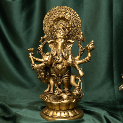Close-up of Ashtabhuja Lord Ganesh brass idol with fine carving.