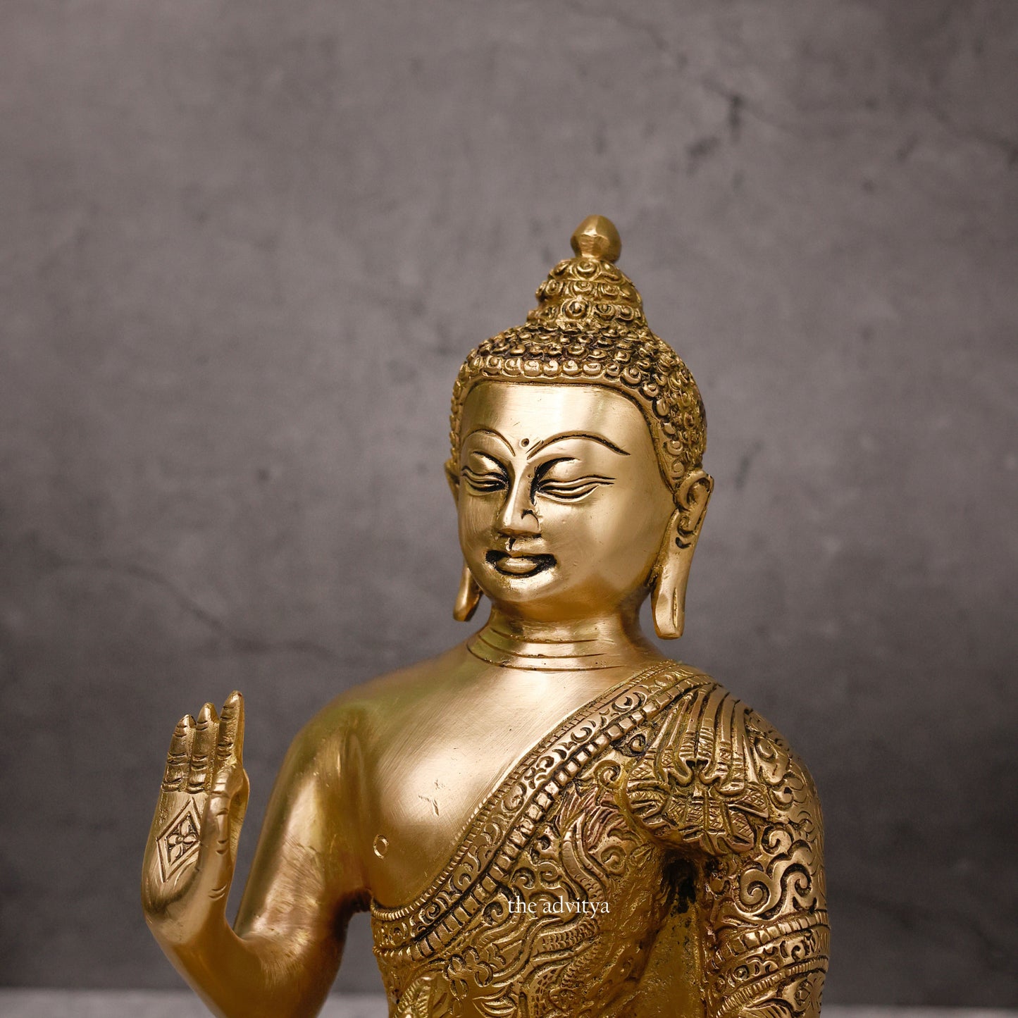 Authentic brass protection Buddha statue front view for Vastu and Feng Shui.