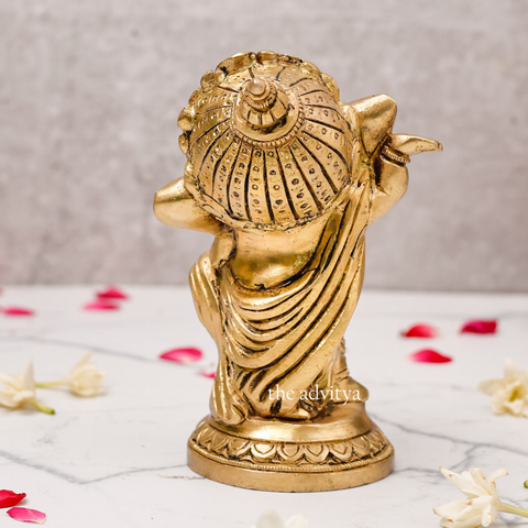Back view of 5.5-inch Baby Dancing Ganesha Idol in gold for gifting.