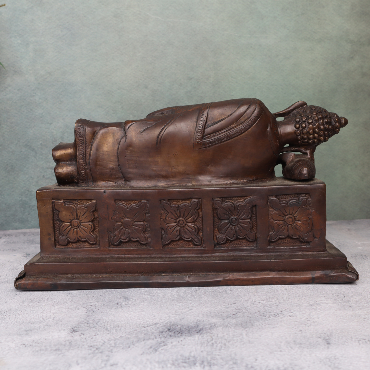 Back view brass antique sleeping Buddha statue ideal for home decor and meditation spaces.