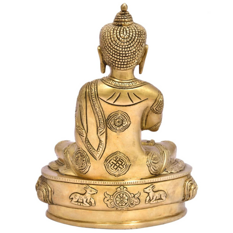 Back view of the lotus base of a sitting Buddha brass statue with finely carved floral patterns