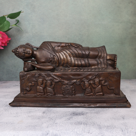 Brass antique sleeping Buddha statue showing serene reclining posture and detailed craftsmanship
