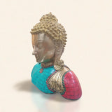 Left angle view of a brass Buddha idol bust with detailed stone inlay.