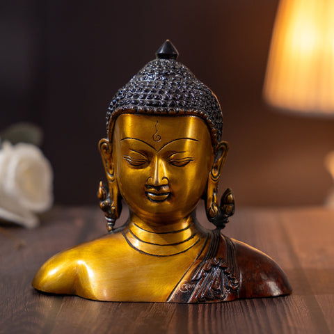 Close view of Nepali Brass Buddha Murti Bust with elegant shawl, showing intricate brass carving.