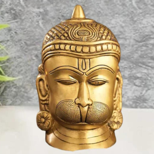 Brass engraved Hanuman statue front view with detailed facial carving and traditional craftsmanship.