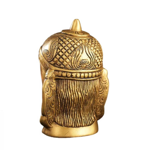 Back view of brass engraved Hanuman statue displaying detailed head engravings and traditional design