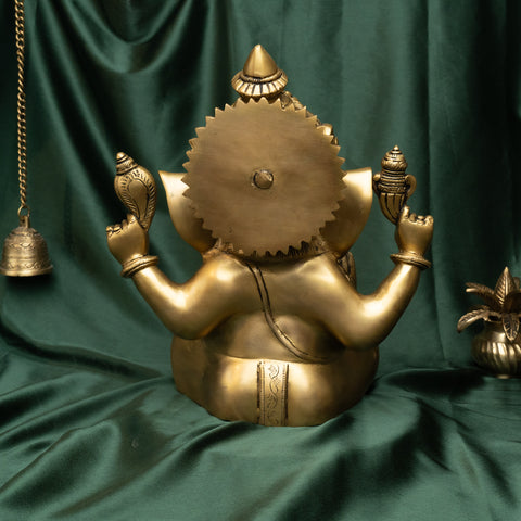 Back view of brass Ganesha blessing statue highlighting solid brass finish.