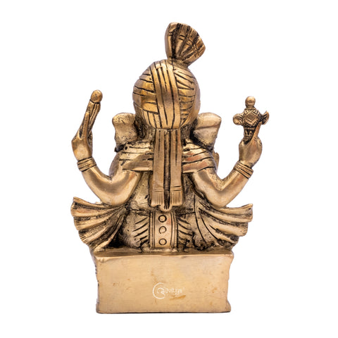 7 inch Brass Vighnaharta Lord Ganesha idol placed in home mandir décor bak view