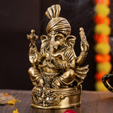 Left side view of 7 inch Brass Vighnaharta Ganesha idol with pagdi and antique finish