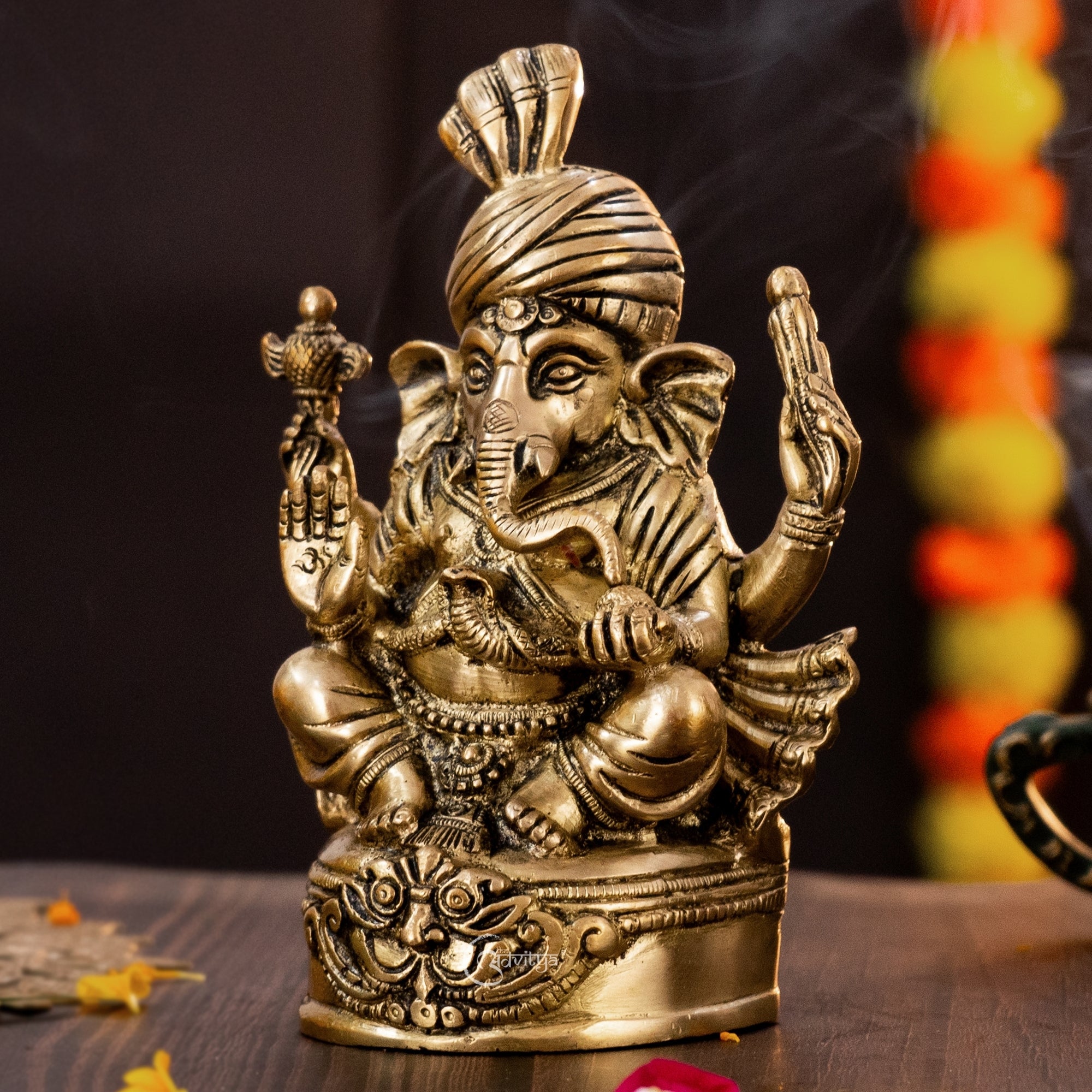 Left side view of 7 inch Brass Vighnaharta Ganesha idol with pagdi and antique finish