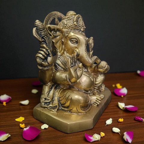 Side angle of 7.5 inch brass Ganesha statue showing Shankh and detailed craftsmanship.