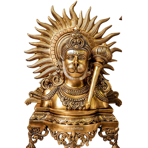 Front view of brass Hanuman bust idol with gada showing detailed facial features and ornate halo with white background.