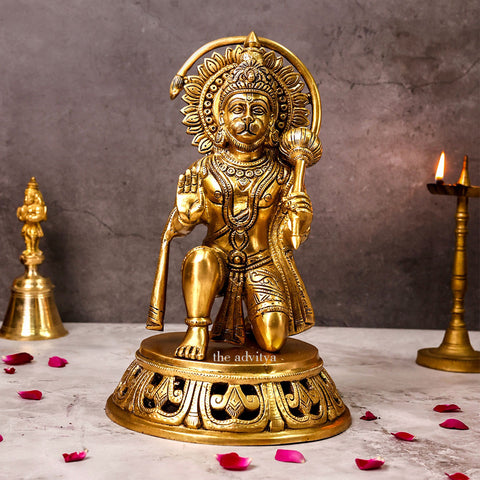 Close-up detail of blessing hand on a brass Hanuman idol