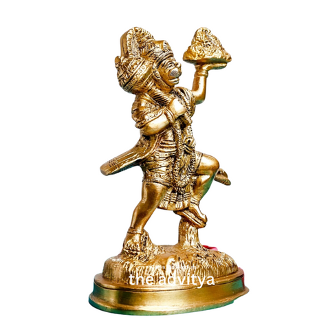 Right angle view of brass Hanuman idol with Sanjeevani mountain with white background.