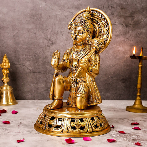 Side view of brass Hanuman idol in sitting posture with blessing hand