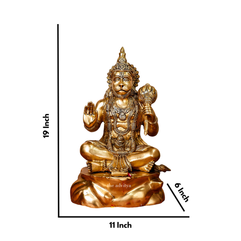 Close-up details of handcrafted brass Hanuman statue showing facial and jewelry work