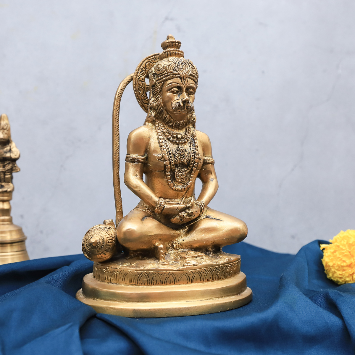 Right angle view of brass Hanuman statue in dhyan mudra