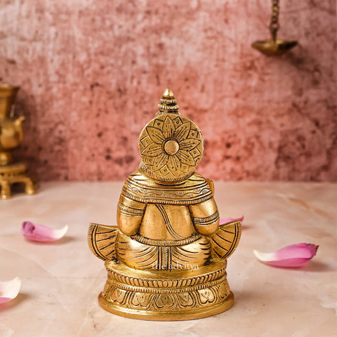 Back view of Brass Kuber Statue showing smooth brass finish.