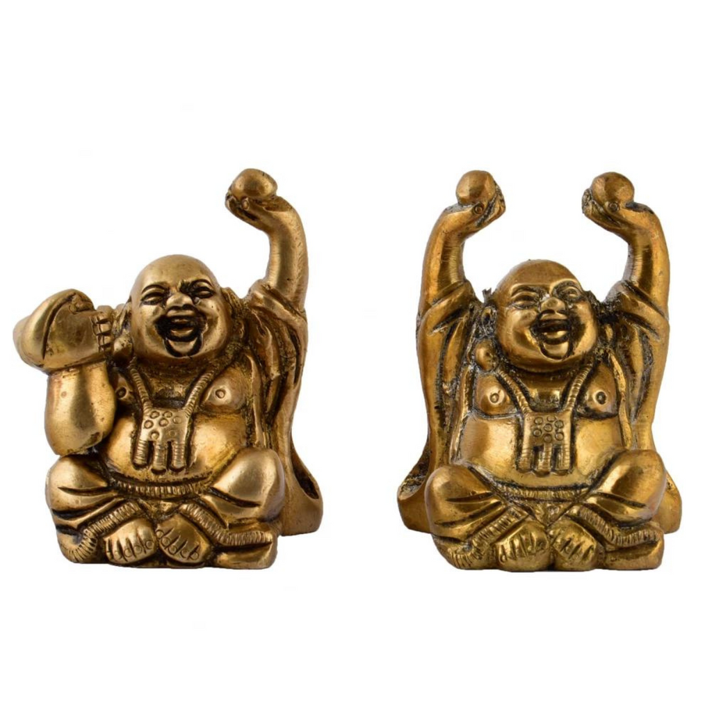 Front view of brass laughing Buddha idols with joyful expression
