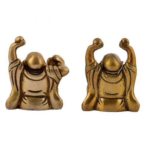 Pair of brass laughing Buddha idols displayed for home décor and positivity in the back view.