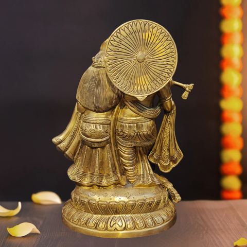 Back detailing of brass Radha Krishna standing idol with fine craftsmanship.
