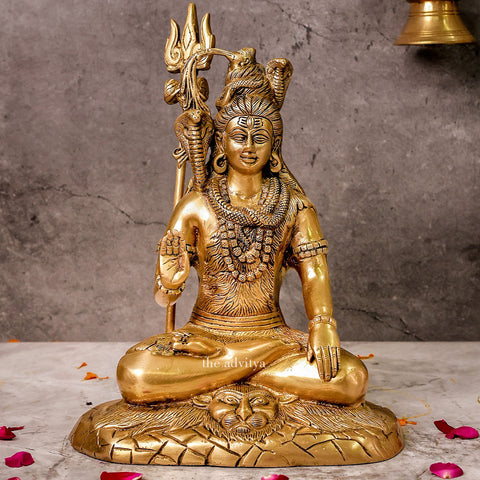 Brass Shiva Statue meditating on a lion mat for home temple décor.