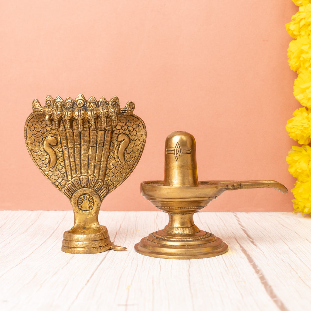 Brass shivling with seven-headed snake front view for home temple.
