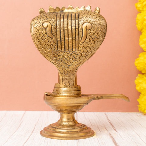 Back view of Brass shivling with seven-headed snake design.