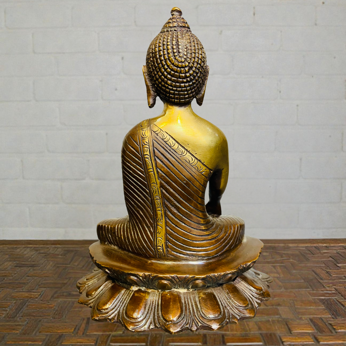 Back detailing of brass sitting Buddha sculpture handcrafted finish