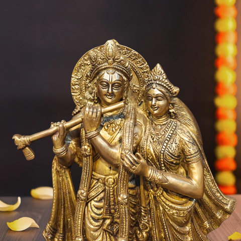 Close-up of brass Radha Krishna idol symbolizing divine love.
