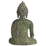 Brass Tibetan Buddha statue in earthy tones, reflecting artisanal craftsmanship.